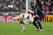 Loons forward Bongokuhle Hlongwane tangled with Orlando City’s Facundo Torres when the teams met April 15 at Allianz Field.