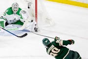 Stars goalie Jake Oettinger stopped a shot by the Wild’s Marcus Johansson in the closing seconds of Sunday’s game.