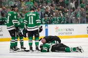 Dallas’ Radek Faksa lay on the ice after colliding with the Wild’s Marcus Foligno in the first period Tuesday. Foligno was assessed a five-minute 