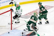 Roope Hintz (24) celebrated a Dallas goal near Wild goalie Filip Gustavsson during Game 4 on Sunday at Xcel Energy Center.
