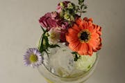 The Bacchanalia Gin and Tonic at Mr. Paul’s Supper Club is delightfully over the top with Du Nord gin, tropical tonic, seltzer, flowers and a spritz