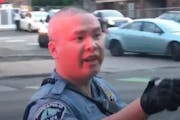 Tou Thao, as he stood between concerned bystanders as George Floyd was being killed on May 25, 2020, by fellow police officers.