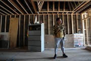 Rob Yang looks over construction on his University Avenue property Wednesday, May 3, 2023 in St. Paul. Yang purchased the space after his other locati