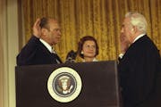 Chief Justice Warren Burger administers the Oath of Office to President Gerald Ford while Betty Ford looks on.