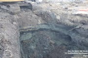 Gray petroleum-contaminated soil is excavated at the site of a Cenex gas station leak on Oct. 25, 2022. The Minnesota Pollution Control Agency sued th