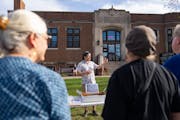 Jonathan Oppenheimer, one of the founding members of “Renovating 1558” spoke to a small crowd Thursday outside of Hamline Midway Library in St. Pa