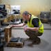 In the intake sorting area, Luke Kragenbrink, an environmental health and safety specialist, looked at a portable record player that Repowered’s St.