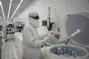 Polar Semiconductor employees work in one of three fabrication areas inside the company’s expansive clean room in Bloomington. The company is in the