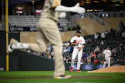 Minnesota Twins relief pitcher Jorge Alcala (66) reacts after giving up a 3-run home run to San Diego Padres third baseman Manny Machado (13) in the t
