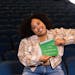Islaea Anderson, a senior at Johnson High School in St. Paul, posed with her green envelope after she was surprised with a Wallin scholarship. 