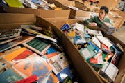 Marla Butler sorted books at Books for Africa in St. Paul in 2017.