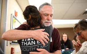 COVID survivor Rick Ulrich, of Norwood Young America, embraced critical care nurse Holly Vilione at North Memorial Health Hospital’s South Seven Int