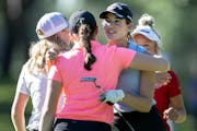 Blaine’s Kathryn VanArragon, surrounded by competitors at the state meet last spring, is going through “really busy weeks” thanks to a golf sche