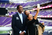 At a Vikings alumni weekend, Maya Washington took a selfie with her father Gene, left, along with Clinton Jones, a college and NFL teammate.
