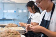 Linda Cao and Peter Bian, co-founders of Saturday Dumpling Co., assembled pork, shrimp and chive dumplings.