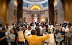 Uber and Lyft drivers rallied outside the House chamber as bills moved through the Legislature that would give the drivers pay raises and job protecti