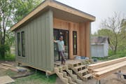 Family Handyman projects editor Mike Berner stands on the porch of a new sustainable structure he helped build at the Dodge Nature Center in West Sain