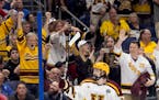 Gophers fans celebrated after Logan Cooley scored an empty-net goal against Boston University in the NCAA Frozen Four semifinals this year.