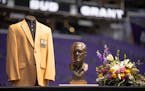 A Hall of Fame jacket and bust of former Minnesota Vikings coach Bud Grant sit on stage during a public memorial for the former Minnesota Vikings coac