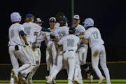 Champlin Park’s players celebrated a victory over Centennial that helped the Rebels take the No. 1 position in the Metro Top 10.