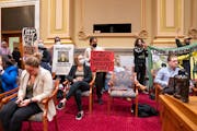 Protestors interrupted a Minneapolis City Council meeting last fall, calling for a chance to speak against the demolition of the Roof Depot building.