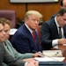 Former President Donald Trump at the defense table with his defense team in a Manhattan court, April 4, 2023, in New York.