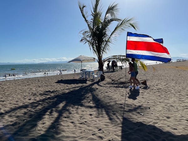 A Costa Rican flag flutters on the beach in downtown Puntarenas.