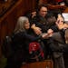 Representatives in the House hugged and high fived after they adjourned Monday night. The Minnesota Legislature scrambled to complete their work befor