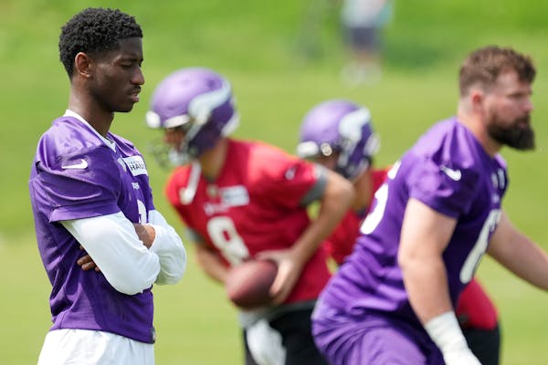 Vikings first-round draft pick Jordan Addison, left, was held out of Tuesday’s practice for undisclosed reasons. 