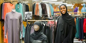 Muna Mohamed with her Kalsoni activewear line at the REI store in Roseville.