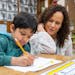 Shivam Roy practiced his writing and spelling while working with Principal Maria Roberts during a phonics lesson on Thursday at Wilshire Park Elementa