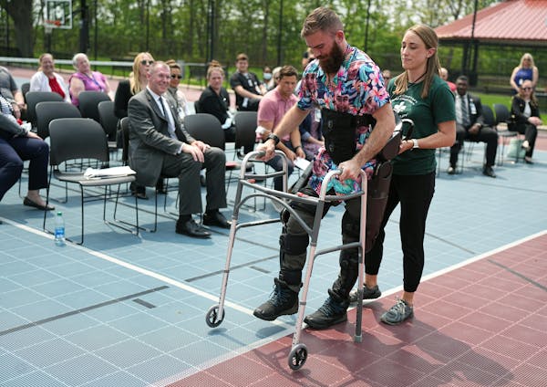 Veteran Wesley Farwell used the robotic device with the help of physical therapist Crystal Stien on May 22, at a ceremony to celebrate the donation.
