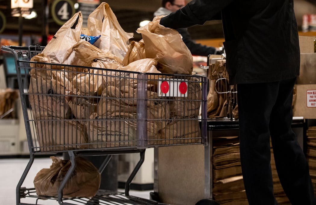 A shopper loaded up a cart full of plastic bags at a Duluth grocery store in 2019.
