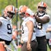 Za’Darius Smith, right, with new Cleveland Browns teammates Sam Kamara, left, and Trysten Hill, center, during practice Wednesday. 