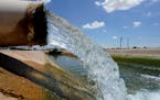 Water from the Colorado River diverted through the Central Arizona Project fills an irrigation canal on Aug. 18, 2022, in Maricopa, Ariz. Arizona, Cal