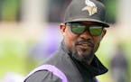 Vikings defensive coordinator Brian Flores looks on during offseason organized team activities Tuesday