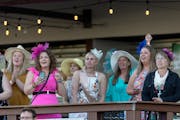 Fans cheered on a race as they also celebrated a bachelorette party on opening night at Canterbury Park in Shakopee on Saturday.