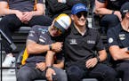 Tony Kanaan, of Brazil, left, jokes with Alex Palou, of Spain, during the drivers meeting for the Indianapolis 500 auto race at Indianapolis Motor Spe