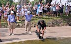 A cameraman filmed and the gallery cheered as Emiliano Grillo’s ball comes to a rest against a rock after floating down a concrete drainage canal on
