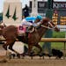 Mage (8), with Javier Castellano aboard, across the finish line to win the 149th running of the Kentucky Derby horse race at Churchill Downs Saturday,