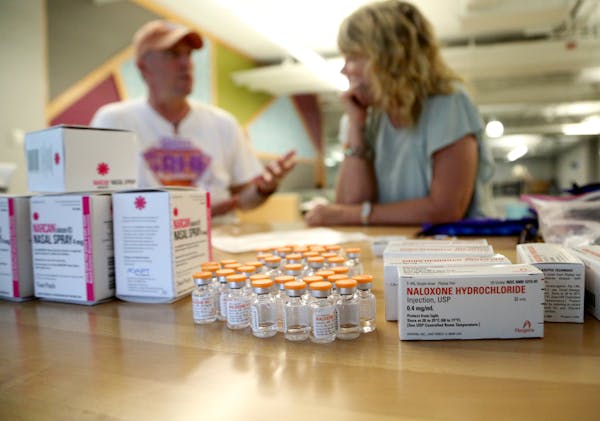 Volunteers put together naloxone kits at the headquarters for the nonprofit Steve Rummler HOPE Network.