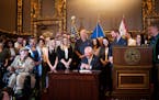 Former Gov. Jesse Ventura was on hand as Gov. Tim Walz legalized marijuana in Minnesota with the stroke of a pen on Tuesday.