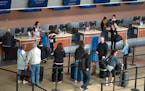 Lines outside the ticket window at Sun Country Airlines in Terminal 2 on Tuesday, March 5, 2019.