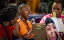 Alicia Davis, 15, was overcome with emotion Wednesday as she discussed the death of her brother, 14-year-old Alan Davis, at Shiloh Temple in Minneapol