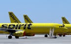 FILE - A line of Spirit Airlines jets sit on the tarmac at Orlando International Airport on May 20, 2020, in Orlando, Fla. The airline experienced sig
