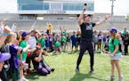 Minnesota Vikings head coach Kevin O’Connell concludes a volunteer community event with chant Thursday, June 1, 2023, at TCO Performance Center in E