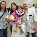 In this photo provided by Vernon Tyau, Jarek Agcaoili, left, with his mother Danielle, sister Jessika and father Maury Agcaoili pose in May 2023, at J