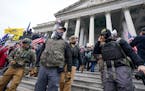Members of the Oath Keepers extremist group on the East Front of the U.S. Capitol on Jan. 6, 2021, in Washington. 