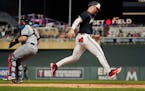 Minnesota Twins pinch-runner Ryan Jeffers scores the winning run against the Cleveland Guardians during the ninth inning of a baseball game Thursday, 