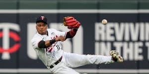 Twins second baseman Jorge Polanco missed the catch before grabbing it and throwing to first to get Cleveland’s Andres Gimenez out at first in the s